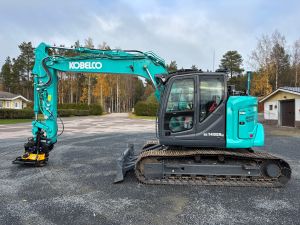 KOBELCO SK140SRLC-7 + PUSKULEVY + RASVARI + LÄMMITIN + EC219 PIHDILLÄ + NOVATRON 3D
