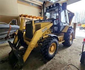 CAT 438B, trukkipiikit, 6 kauhaa, Grävlastare