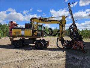 Sandvik DQ 240 ja Komatsu PW 180-7K